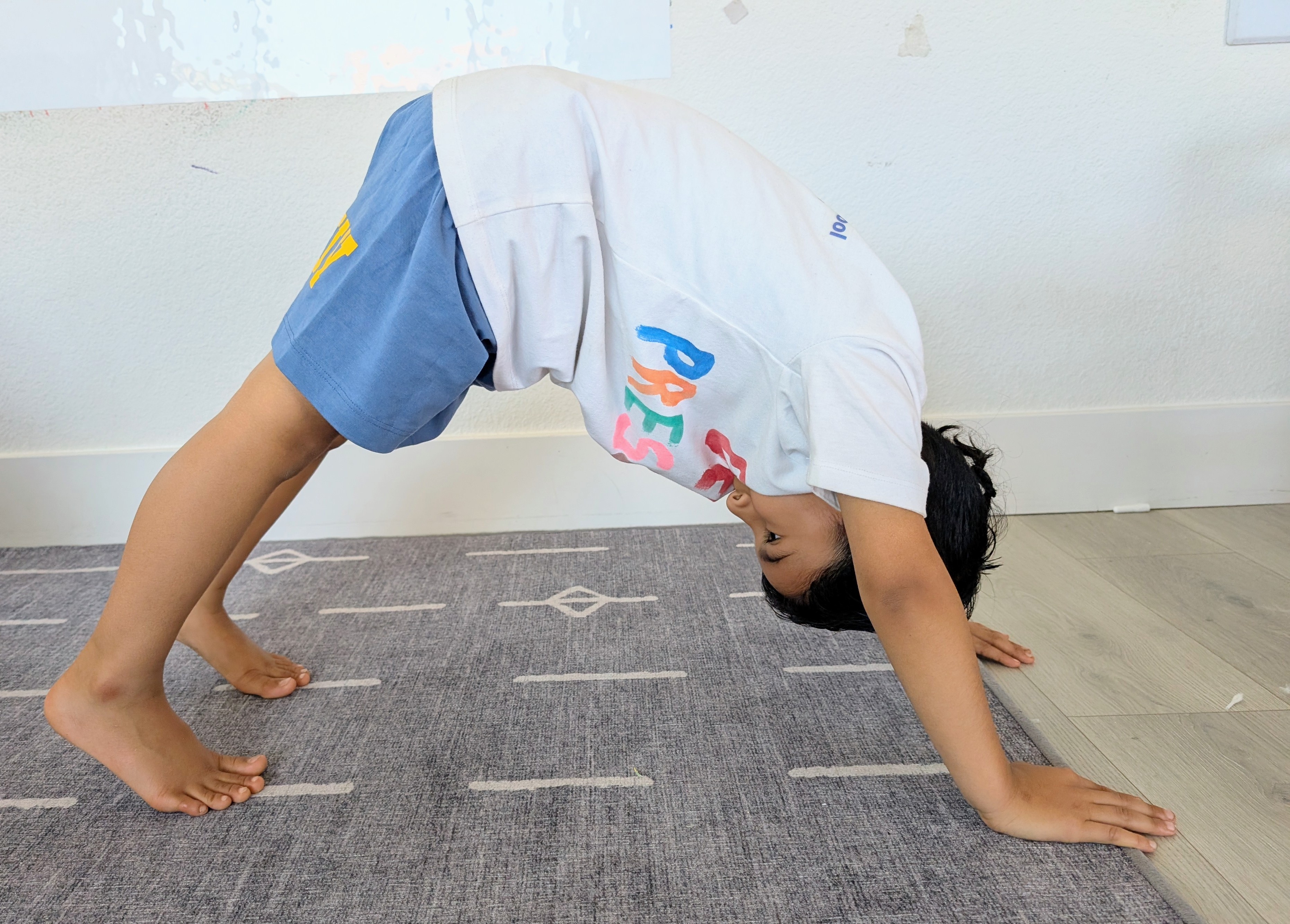 Child practicing a yoga pose